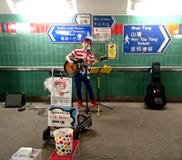 Gataaktör i Hong Kong royaltyfri foto Gataaktör i Hong Kong royaltyfri foto