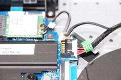A geek cleans a laptop cooler. Contaminated computer cooling system. stock image A geek cleans a laptop cooler. Contaminated computer cooling system. stock image