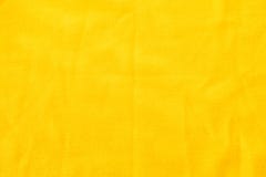 Gelbe gewirkte Gewebebeschaffenheit Material crumped ein kleines stockbilder Gelbe gewirkte Gewebebeschaffenheit Material crumped ein kleines stockbilder