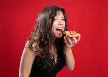 Gelukkige vrouw die pizza eet stock afbeelding Gelukkige vrouw die pizza eet stock afbeelding