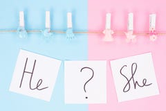 Gender Reveal Gathering Party Concept. Close Up Photo Of Small Clothespins With Little Footprint Beanbag Bib Hanging On A Rope Royalty Free Stock Photography