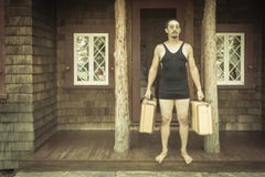 Gentleman Dressed in 1920’s Era Swimsuit Holding Suitcases on royalty free stock photos Gentleman Dressed in 1920’s Era Swimsuit Holding Suitcases on royalty free stock photos