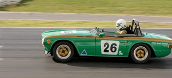 Geoff Byrne in a 1969 Triumph TR6 on the front straight at Winton Royalty Free Stock Image Geoff Byrne in a 1969 Triumph TR6 on the front straight at Winton Royalty Free Stock Image