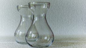 A geometric, rectangular patterned clear glass vase. A rectangular clear glass vase with floral decoration against a white background Royalty Free Stock Photo A geometric, rectangular patterned clear glass vase. A rectangular clear glass vase with floral decoration against a white background Royalty Free Stock Photo