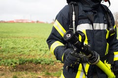 German Firefighter with water hose in action Royalty Free Stock Photo German Firefighter with water hose in action Royalty Free Stock Photo
