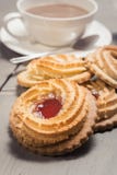 German Ox Eye cookies on a laid table Royalty Free Stock Photos German Ox Eye cookies on a laid table Royalty Free Stock Photos