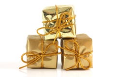 Geschenk des Gold drei klopfte auf Pakete lizenzfreie stockfotografie Geschenk des Gold drei klopfte auf Pakete lizenzfreie stockfotografie