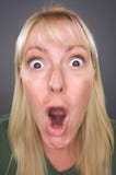 Geschokte Blonde Vrouw met Grappig Gezicht stock foto's Geschokte Blonde Vrouw met Grappig Gezicht stock foto's