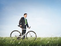 Geschäftsmann-Bike Green Business-Entspannungs-Konzept lizenzfreie stockbilder Geschäftsmann-Bike Green Business-Entspannungs-Konzept lizenzfreie stockbilder