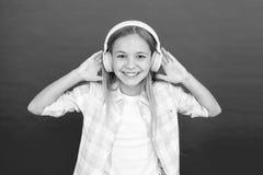 Get music account subscription. Enjoy music concept. Music always with me. Leisure concept. Little girl listen song royalty free stock photo Get music account subscription. Enjoy music concept. Music always with me. Leisure concept. Little girl listen song royalty free stock photo