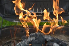 Getting the grill ready for cooking. The flames are ignited. stock photo Getting the grill ready for cooking. The flames are ignited. stock photo