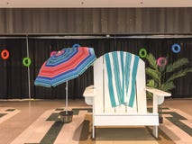 Giant Summer Beach Chair and Umbrella Scene in Shopping Mall royalty free stock photography Giant Summer Beach Chair and Umbrella Scene in Shopping Mall royalty free stock photography