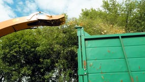 A giant waste blower is pouring the old scarps Royalty Free Stock Photo A giant waste blower is pouring the old scarps Royalty Free Stock Photo