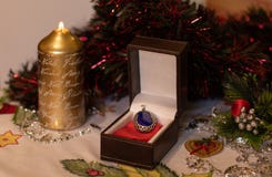 Gift box with a jewel with Christmas decoration stock photos Gift box with a jewel with Christmas decoration stock photos