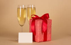 Gift Box With A Bow, Empty Card And Wine Glasses Royalty Free Stock Image Gift Box With A Bow, Empty Card And Wine Glasses Royalty Free Stock Image