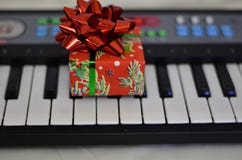 Gift close-up on synth keys with a soft blurred background royalty free stock photos Gift close-up on synth keys with a soft blurred background royalty free stock photos