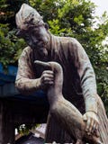 Statue of cormorant fisherman in Gifu, Japan. Gifu, Japan - October 5, 2015: Statue of a fishermen with cormorant, commemorating a local tradition of `Ukai` stock photos Statue of cormorant fisherman in Gifu, Japan. Gifu, Japan - October 5, 2015: Statue of a fishermen with cormorant, commemorating a local tradition of `Ukai` stock photos
