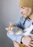 Ginger man with his ginger white cat, love and friendship