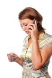 Girl activates a credit card by phone royalty free stock images Girl activates a credit card by phone royalty free stock images