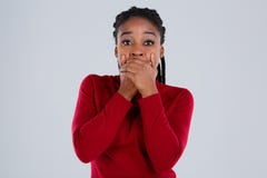 A girl, Afro-American,with her eyes frightened, covered her mouth with her hands. stock photo A girl, Afro-American,with her eyes frightened, covered her mouth with her hands. stock photo