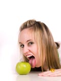 Girl And Green Apple Royalty Free Stock Photography