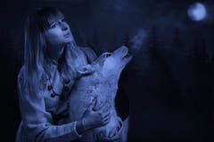 Girl And Wolf In The Deep Forest Royalty Free Stock Photos