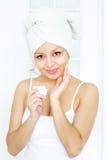 Girl Applying Cream On Skin Royalty Free Stock Photos