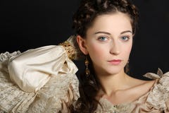 Girl in baroque dress looking at camera stock photo Girl in baroque dress looking at camera stock photo