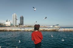 Girl birds sea freedom happiness Barcelona Spain stock photo Girl birds sea freedom happiness Barcelona Spain stock photo