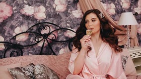 Girl with beautiful hair, drinking champagne. stock video Girl with beautiful hair, drinking champagne. stock video