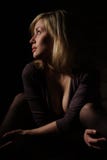 The girl the blonde sitting at a wall. royalty free stock photography The girl the blonde sitting at a wall. royalty free stock photography