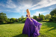 Girl in blowing dress Outdoors Royalty Free Stock Image Girl in blowing dress Outdoors Royalty Free Stock Image