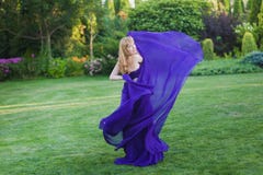 Girl in blowing dress Outdoors Stock Photo Girl in blowing dress Outdoors Stock Photo