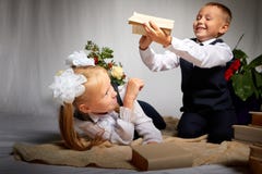 Girl and boy who is elementary school children in uniform having fun with book. Brother and sister on September 1 in