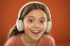 Girl child listen music modern headphones close up. Get music subscription. Access to millions of songs. Enjoy music royalty free stock image Girl child listen music modern headphones close up. Get music subscription. Access to millions of songs. Enjoy music royalty free stock image