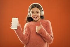 Girl child listen music modern headphones and smartphone. Get music family subscription. Access to millions of songs royalty free stock photo Girl child listen music modern headphones and smartphone. Get music family subscription. Access to millions of songs royalty free stock photo