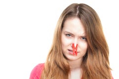 Girl with clothespin on her nose. royalty free stock photography Girl with clothespin on her nose. royalty free stock photography