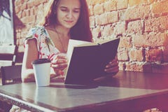 Girl with coffee reading book royalty free stock photos Girl with coffee reading book royalty free stock photos