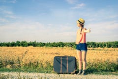Girl doing hitchhiking on the road stock photos Girl doing hitchhiking on the road stock photos