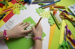 Girl Draws. Children`s Creativity. Favorite Hobby For Children. Materials And Tools. The Child Lies On The Floor And Dra Stock Photos