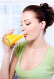 Girl Drinking Fresh Orange Juice Royalty Free Stock Image