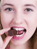 Girl Eating Chocolate Royalty Free Stock Image