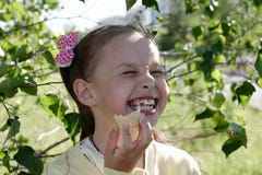 Girl eating ice cream and laughing Royalty Free Stock Photography Girl eating ice cream and laughing Royalty Free Stock Photography