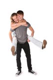 Girl Embraces Boy From Behind Stock Images