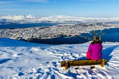 Girl enjoying view of Tromso from Fjellstua royalty free stock photography Girl enjoying view of Tromso from Fjellstua royalty free stock photography