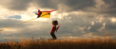 Girl Flying A Kite. Stock Images
