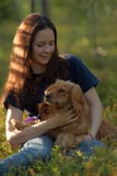 Girl in forest with dog spaniel stock image Girl in forest with dog spaniel stock image