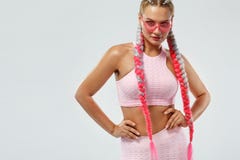 Fitenss athlete woman in a beautiful pink sportswear and pink glasses, on white background. Sport concept. stock images Fitenss athlete woman in a beautiful pink sportswear and pink glasses, on white background. Sport concept. stock images