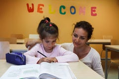 A Girl with her teacher are preparing lessons stock photos A Girl with her teacher are preparing lessons stock photos