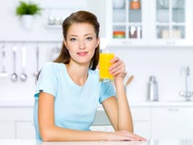 Girl Hold A Glass Of Fresh Orange Juice Royalty Free Stock Image